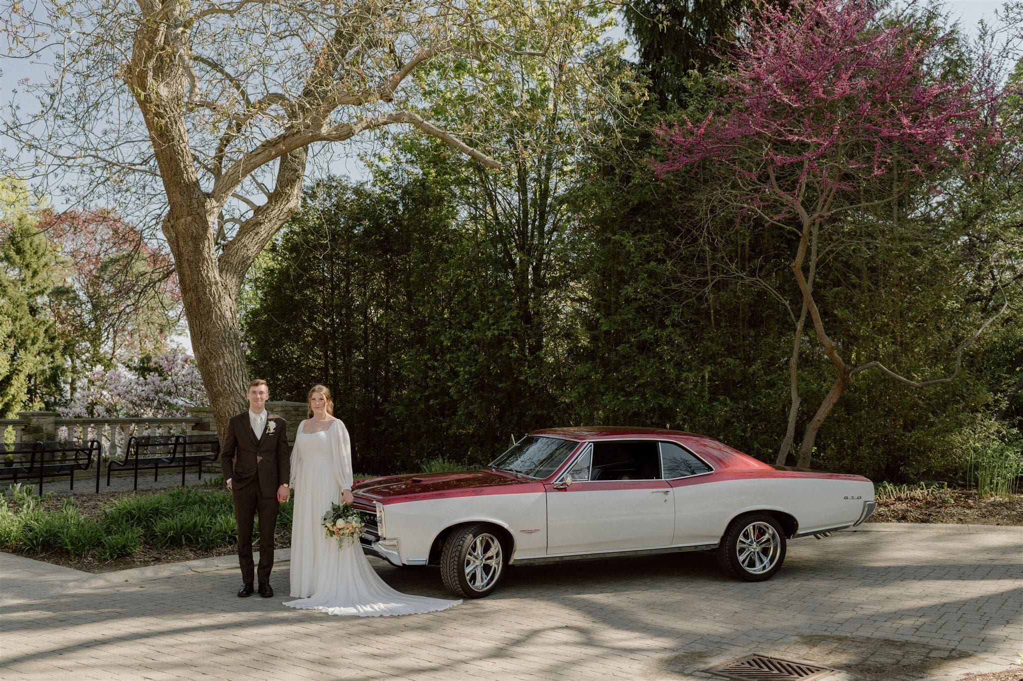 A bride and groom pose at their wedding at Paletta Mansion